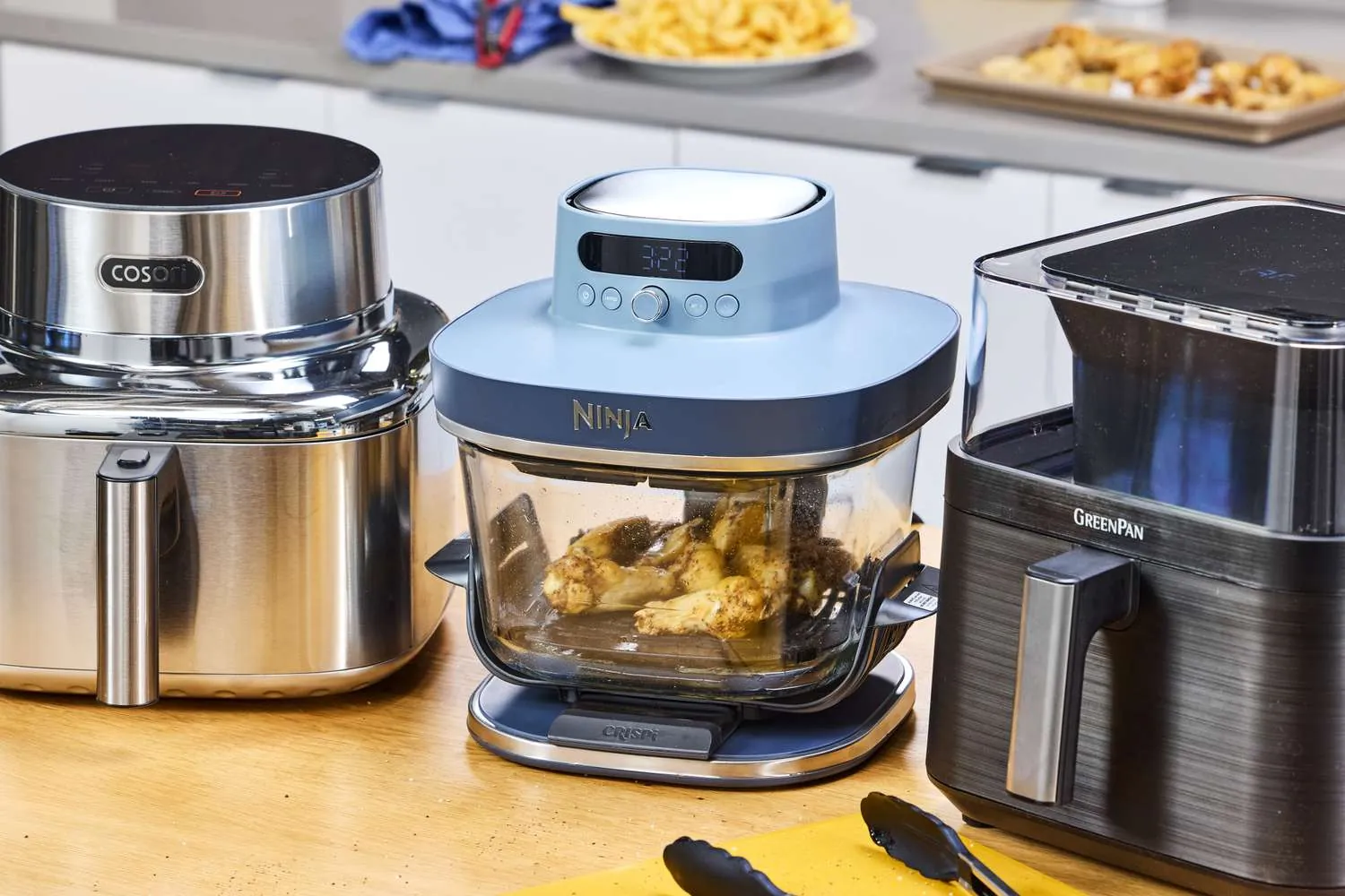 Large premium air fryer filled with roasted chicken and vegetables