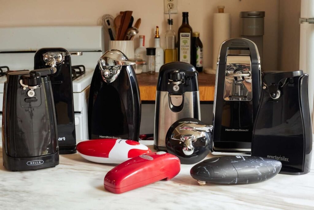 Modern electric can opener on marble counter with open can
