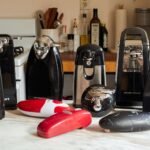 Modern electric can opener on marble counter with open can