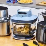 Ninja and Cosori air fryers sitting side by side on a bright kitchen counter