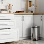 Slim modern trash can fits perfectly in small apartment kitchen space