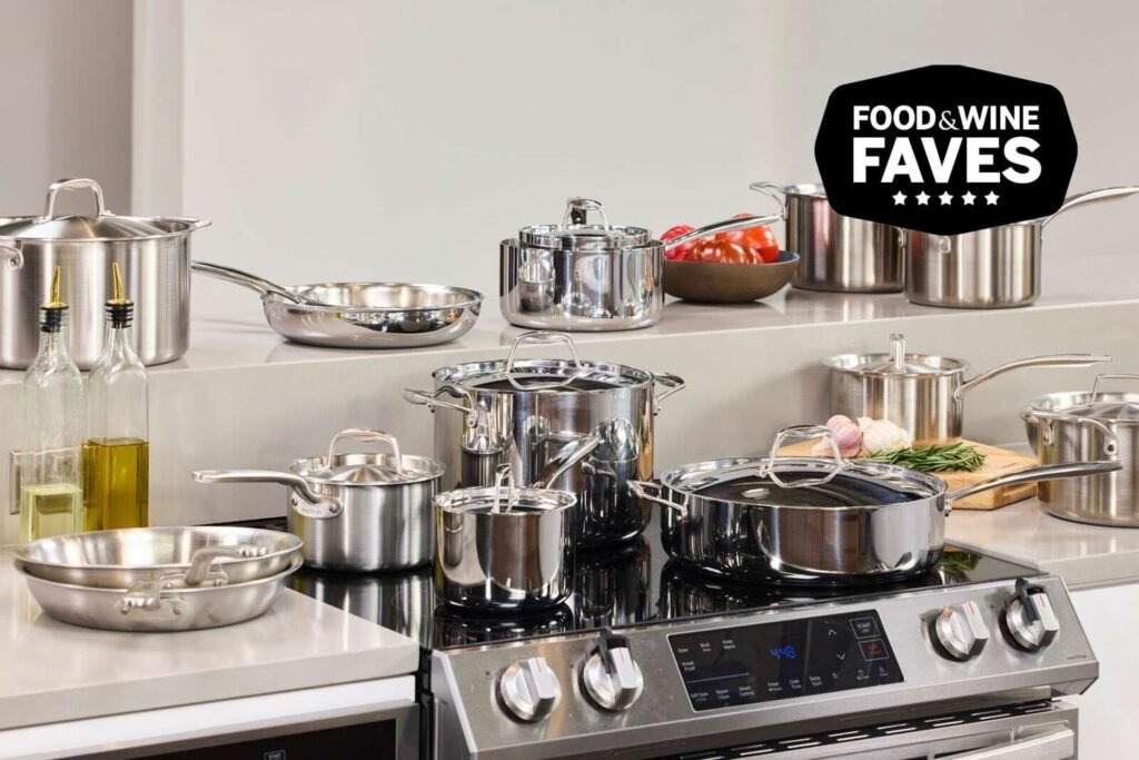 Stainless steel cookware set displayed on a marble kitchen counter
