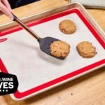 Three versatile baking sheets displaying cookies, roasted veggies, and meal prep readiness.